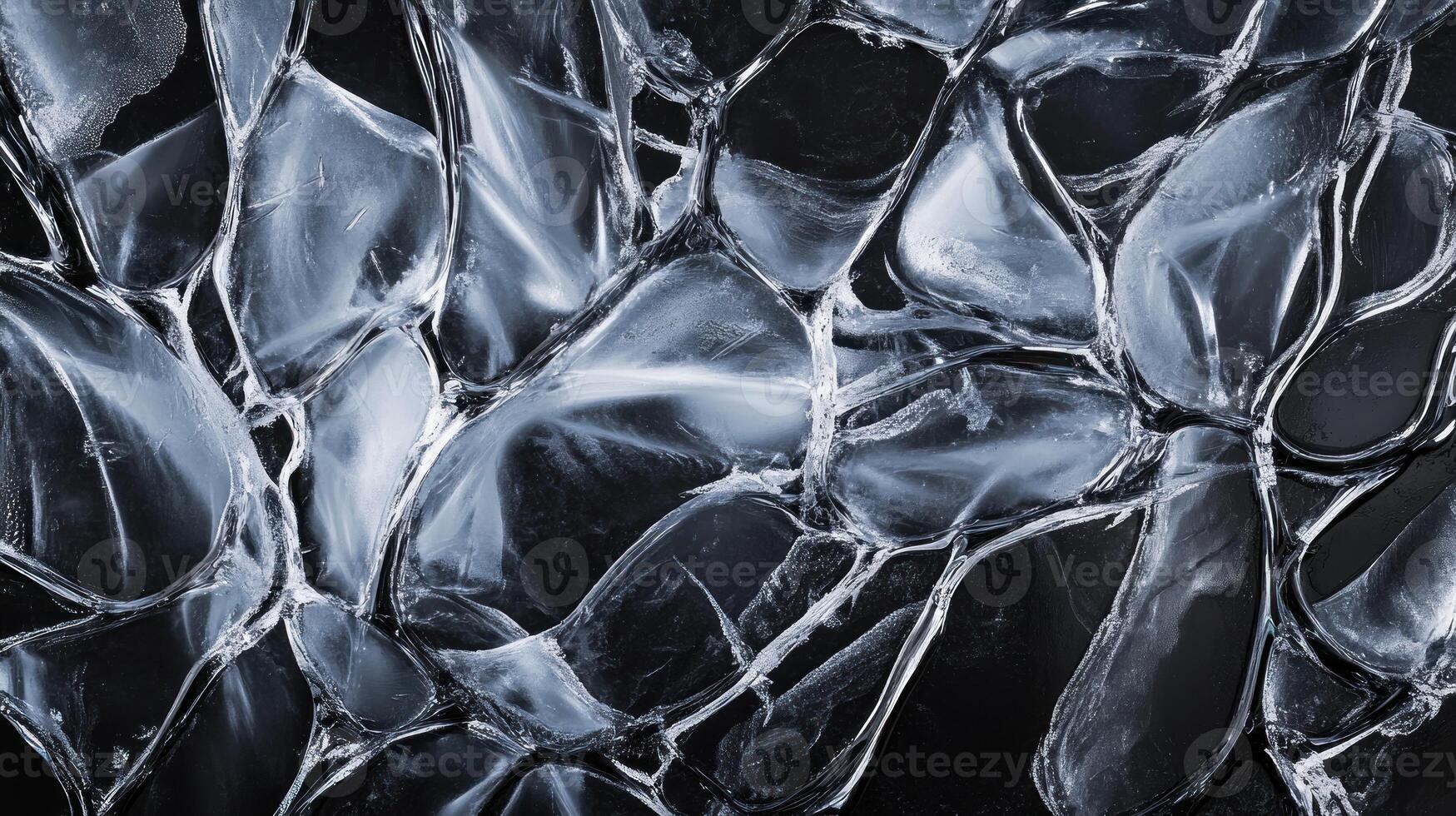 Abstract image of a fractured, icy, or glass-like surface with a network of irregular, translucent shapes in shades of dark blue and gray, creating a complex, almost organic texture photo