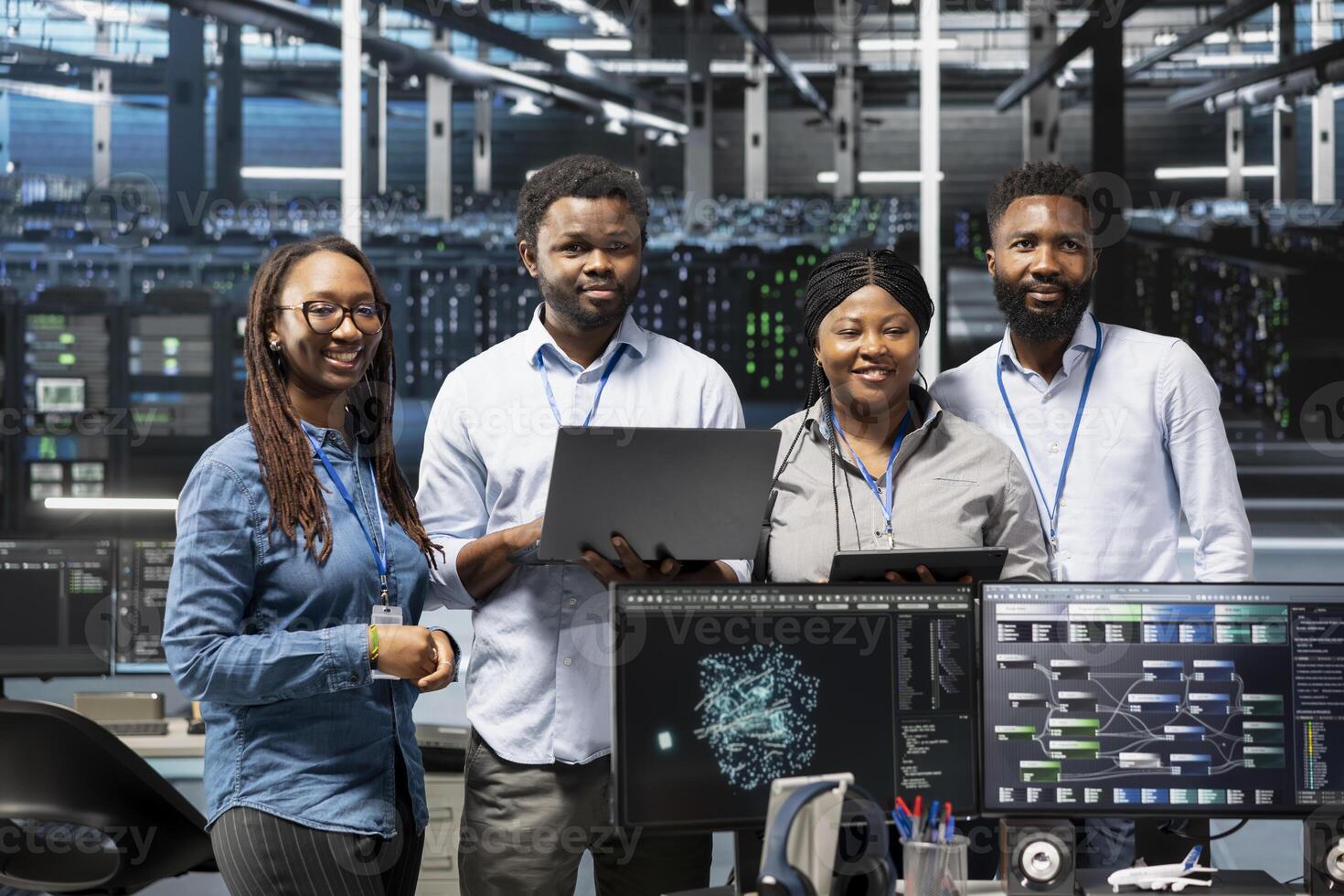 Portrait of smiling data center specialists using machine learning algorithms to analyze large datasets. Happy server farm coworkers using artificial intelligence to recognize facility data patterns photo