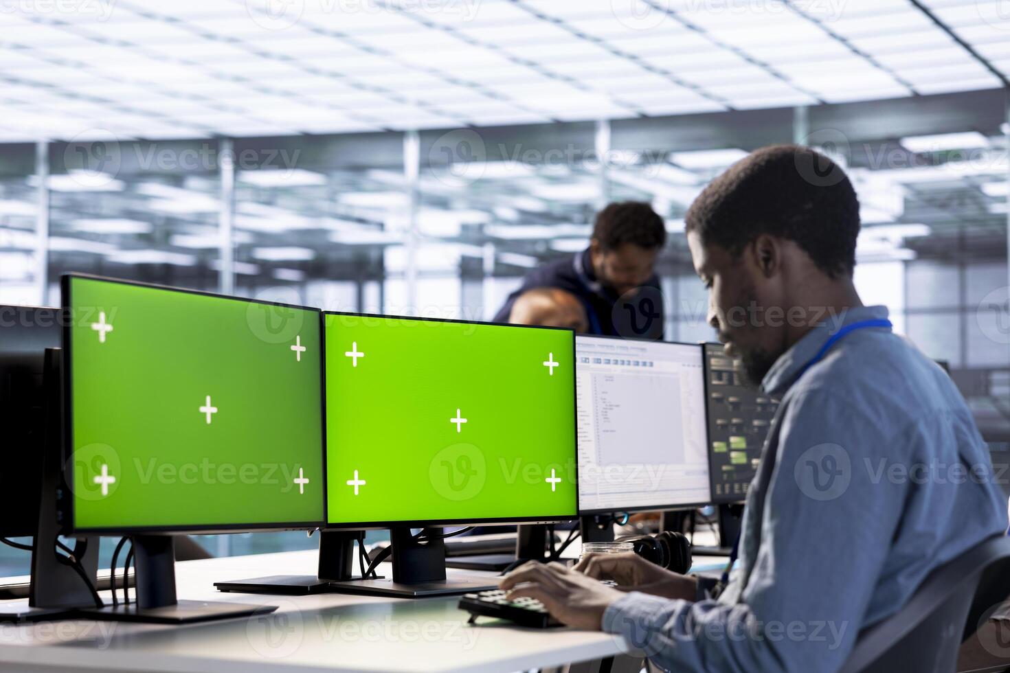 Server hub admin using isolated screen computer to find firewall misconfigurations. Employee checking systems bottlenecks leading to sluggish data transfer rates using multi monitor mockup PC photo