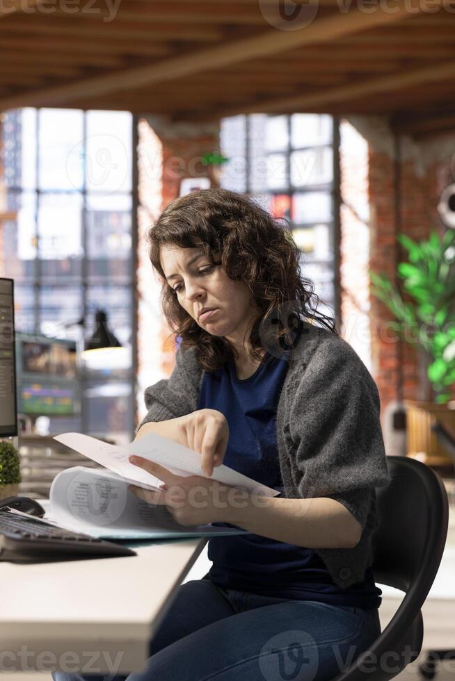 AI powered software generates a virtual spaceship station for a woman developer, interacting with chatbot and gaming software. Generative models assist in futuristic game development. photo