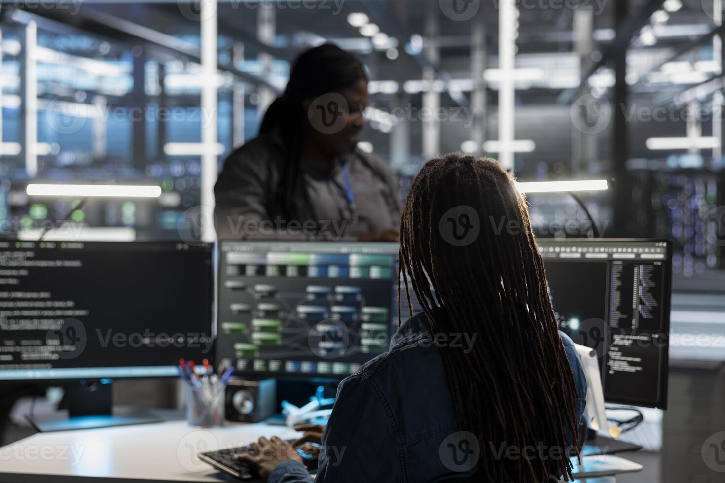 Data center system administrator using artificial intelligence neural networks tech and node trees. Server farm employee using AI programming language on computer, configuring specialized hardware photo