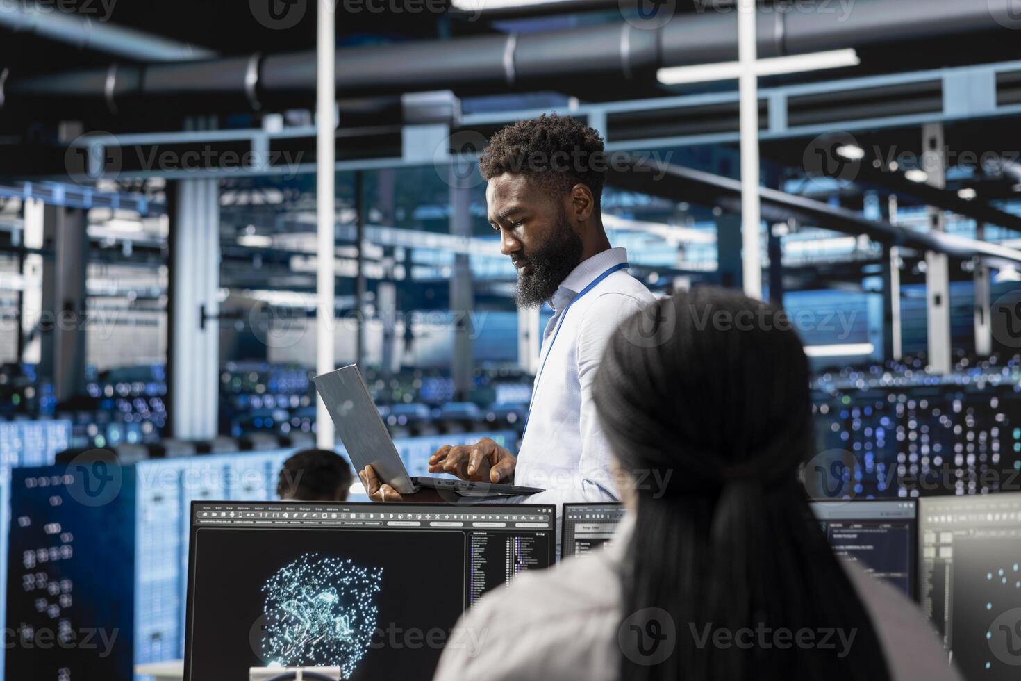 Data center engineer looking at AI visualization dashboard to pinpoint performance issues across server clusters. Server hub worker looks at data analysis graph to reduce hardware failures photo