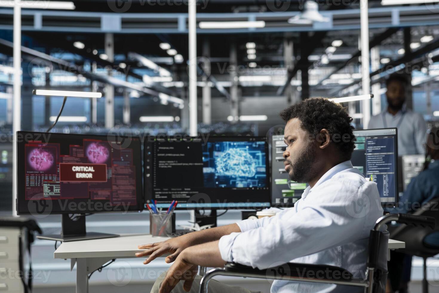 Engineer with paraplegia upset after seeing errors while overseeing data center machines processing workloads. Perplexed worker with disability struggling with fixing glitches while doing maintenance on server rigs photo