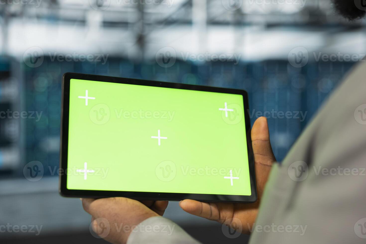 Close up of data center engineer using green screen tablet in data center, performing maintenance on rigs. Server hub worker using mockup device, evaluating diagnostic reports photo