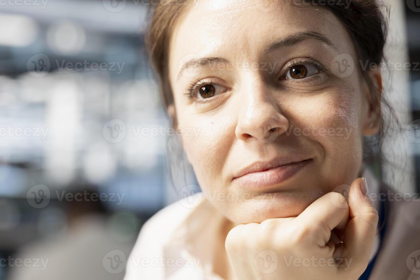 Close up of smiling data center IT professional monitoring system performance, identifying bottlenecks. Upbeat woman in server farm troubleshooting computer bugs, implementing optimizations photo