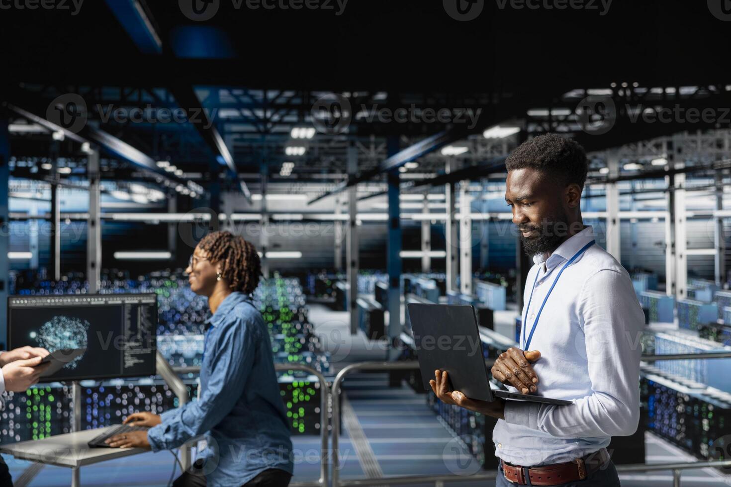 African american smiling engineer in data center monitoring neural network LLM visualization, Server hub IT specialist overseeing machine learning processes for infrastructure development. photo