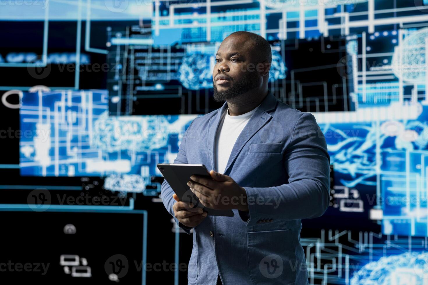Young black technician reviewing AI data visualization and neural networks platforms, smart technology cyberspace systems. Studies machine learning, cloud computing and algorithms. photo