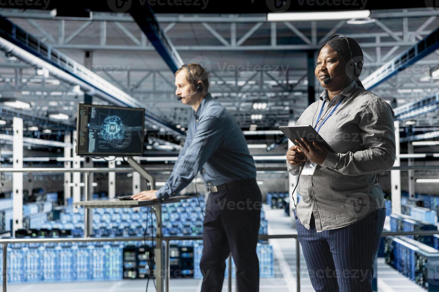 Team of data center IT professionals assisting users with AI troubleshooting, delivering technical support. Server farm colleagues chatting in headset microphone with users in need of assistance photo