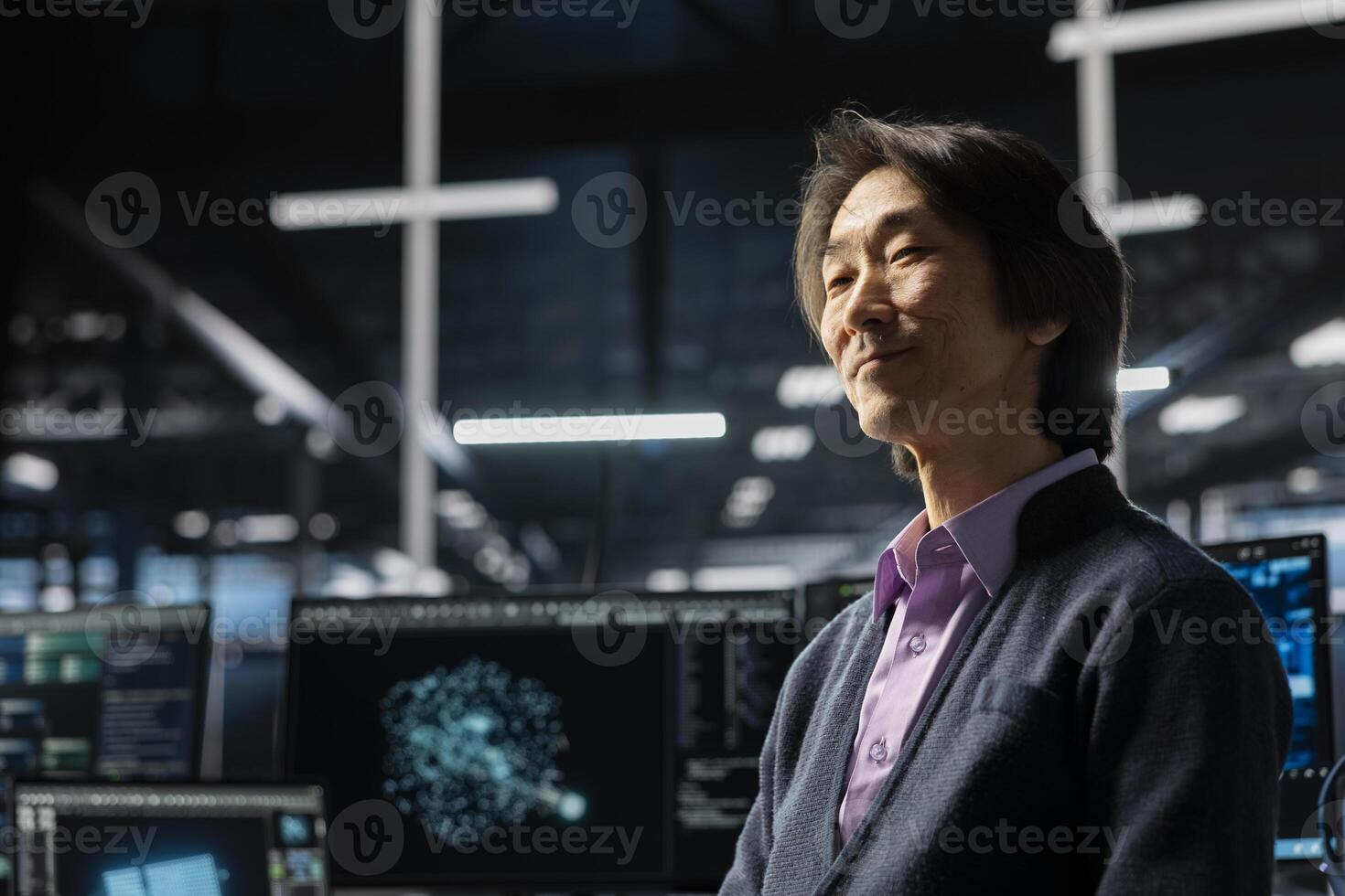 Happy engineer in data center using deep learning LLM assistant to do maintenance on gear rigs. Smiling Asian man in server hub using large language model chatbot to do backups photo