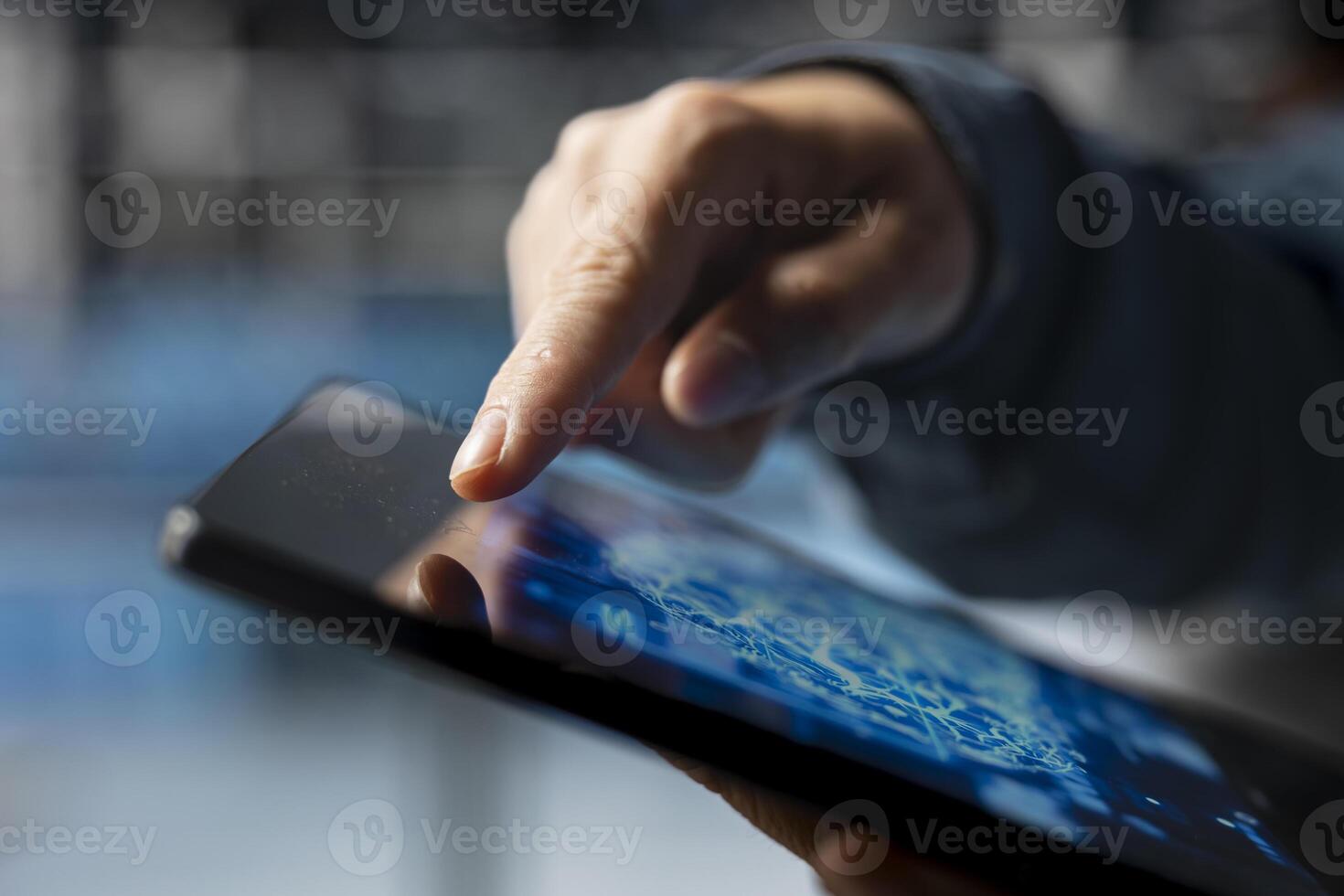 Extreme close up of data center developer using device to do AI algorithms improvements. Programmer in server hub using tablet, maintaining databases supporting AI driven applications. photo