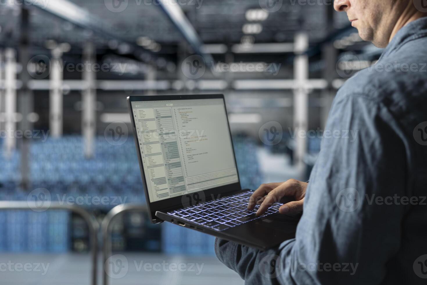 Close up of data center software developer analyzing supercomputers performance, resolving hardware bugs. Server farm IT specialist doing job tasks, coding, doing automatizations photo