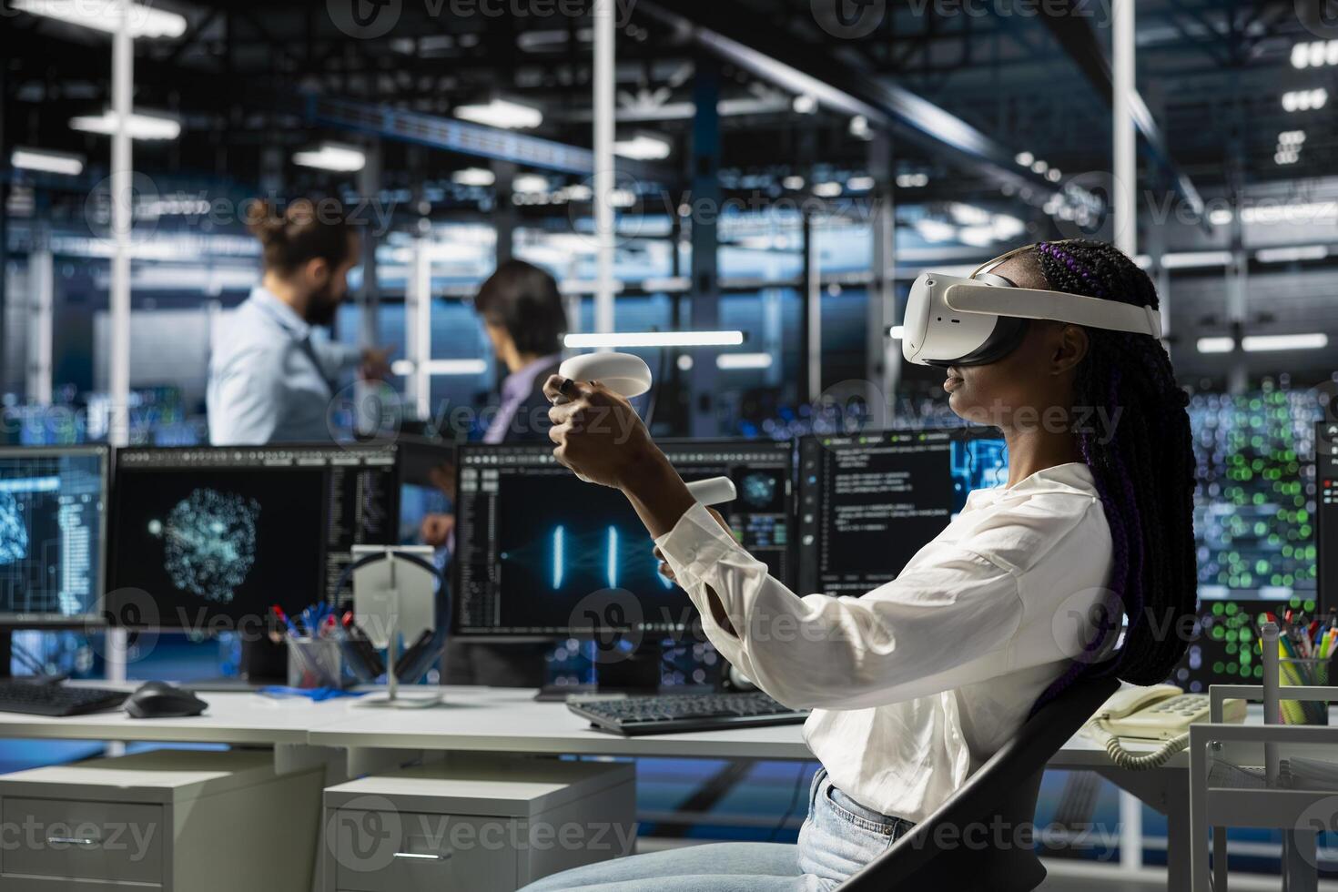 Engineer in data center using virtual reality and AI LLM assistant to do maintenance on equipment rigs. Server hub worker wearing VR headset using large language model chatbot to do backups photo