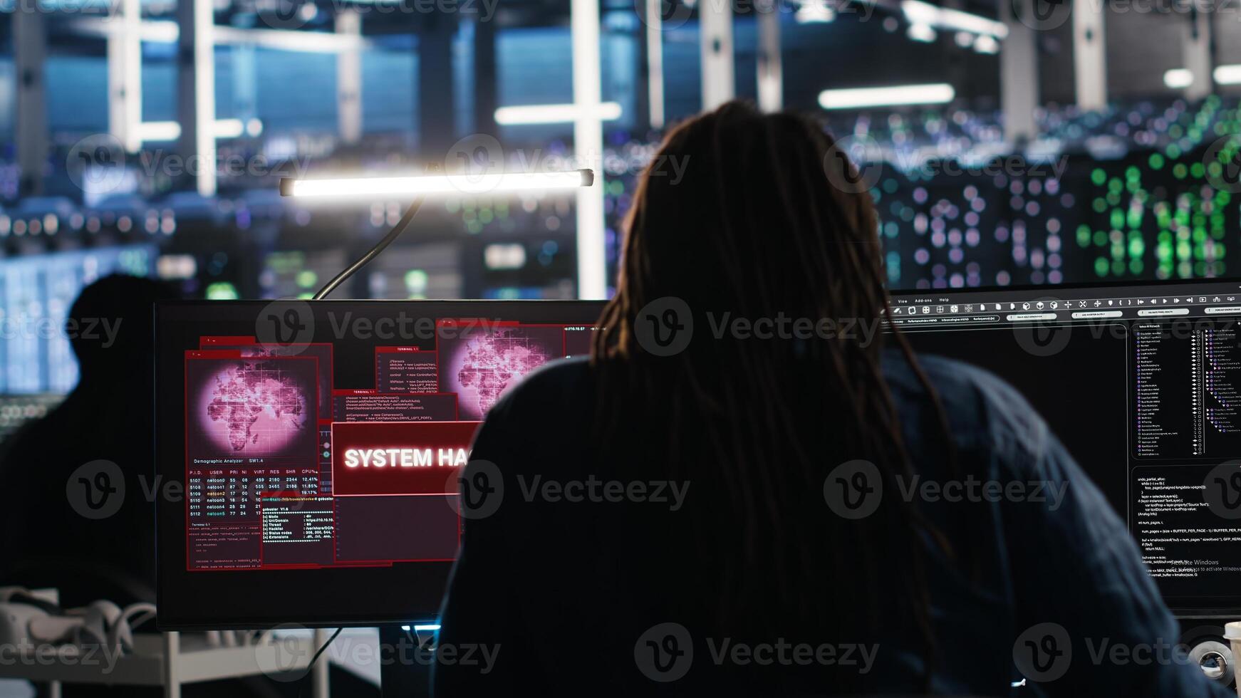 Server hub admin responds to cyberattack attempting to access confidential data while securing hardware systems. Data center worker fighting malware intrusion during security incident, camera B photo