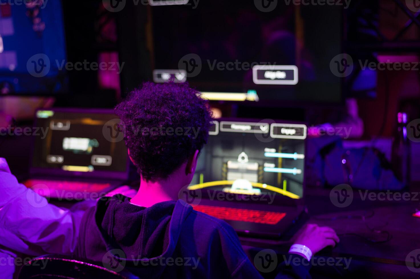 A young boy immersed in a computer game, showcasing modern technology and artificial intelligence in interactive entertainment and digital experiences. photo