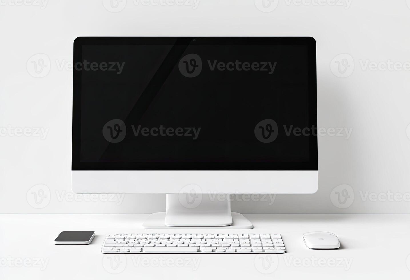 A clean, white desktop computer setup with accessories, facing the camera photo