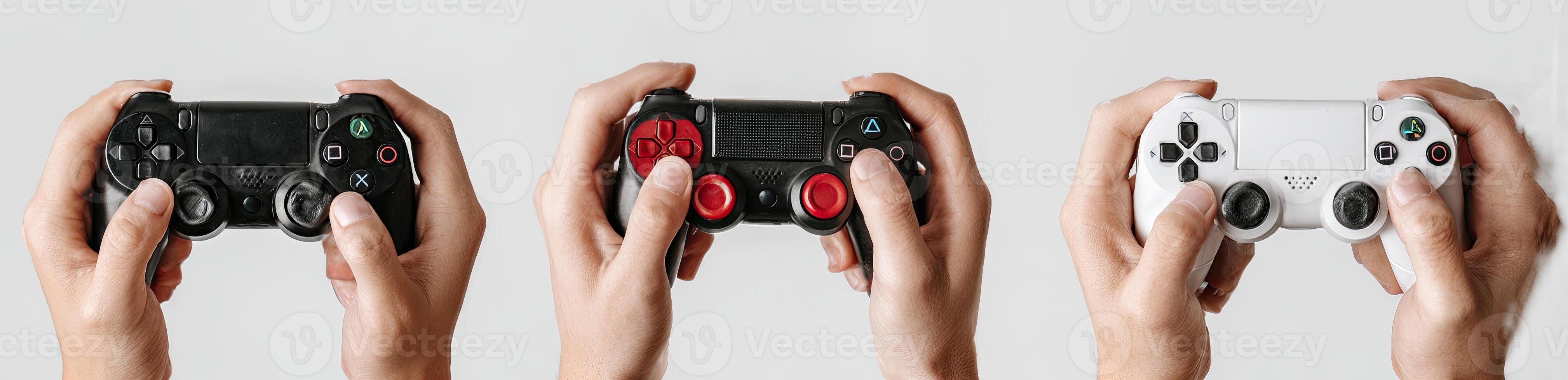 Hands holding three different color game controllers in close-up, against a white background photo