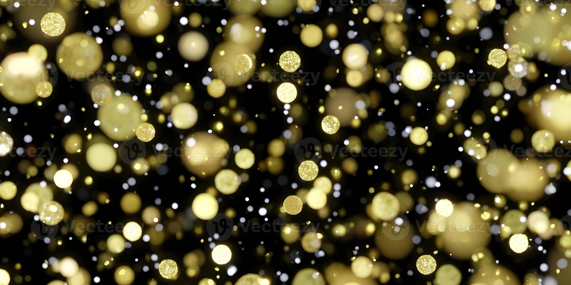 Golden glitter and bokeh lights float on a dark background creating a festive abstract design photo
