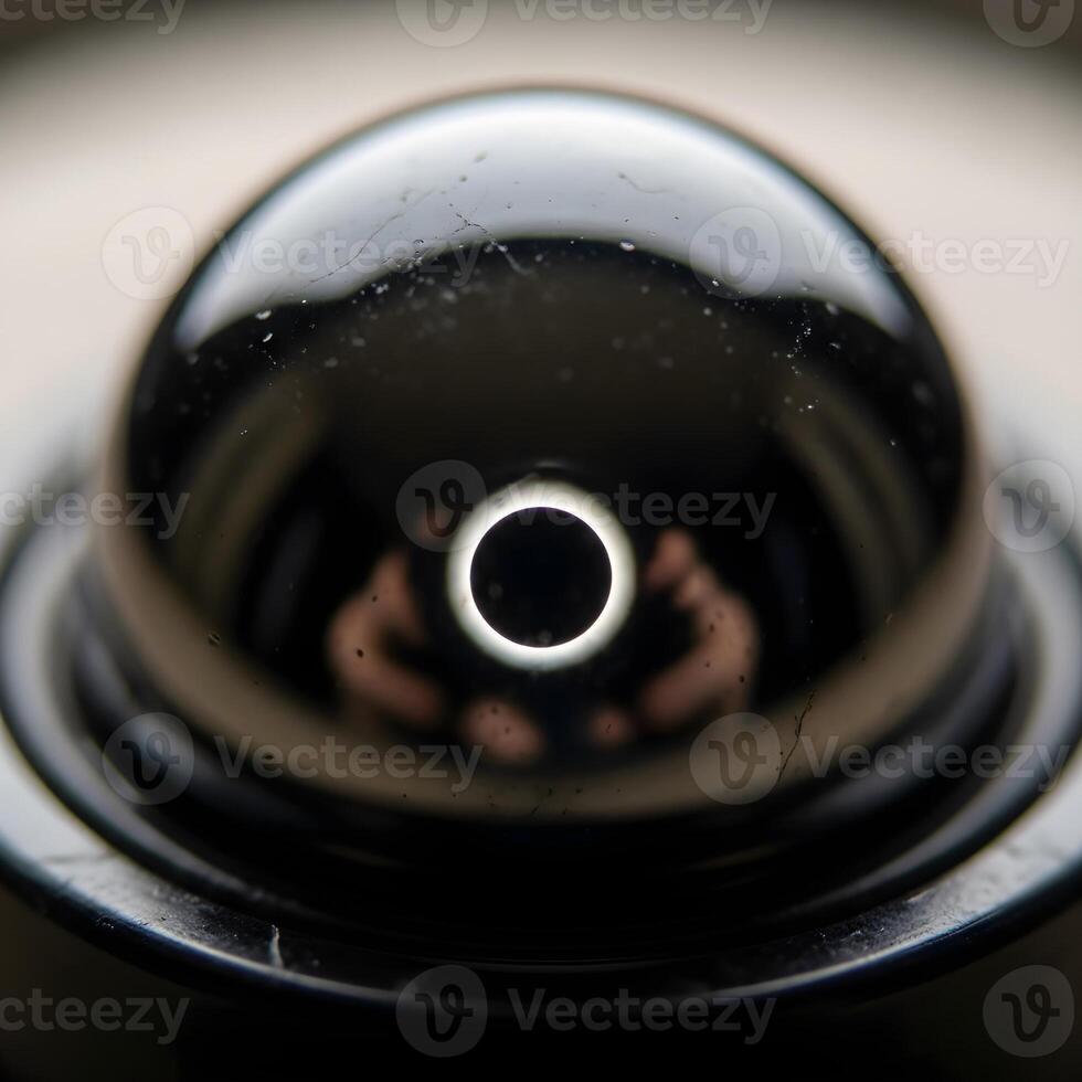 Celestial Mirage A Macro Exploration of Reflective Surfaces Unveiling a Miniature Eclipse with Subtle Illumination, Exquisite Textures, and Harmonized Contrast photo