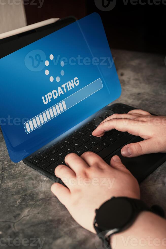 Tablet on desk with virtual installing update screen. Software updates or operating system upgrades. Improved security. photo