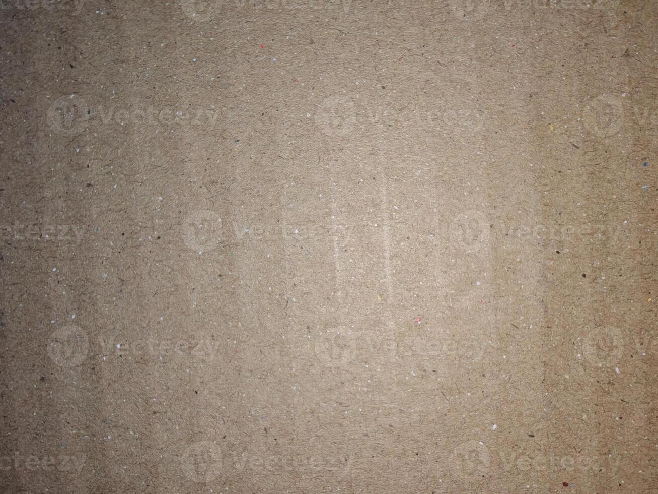 Close-up of brown corrugated cardboard surface with soft focus. Useful as a background, texture, or design material for packaging, eco, and craft concepts photo