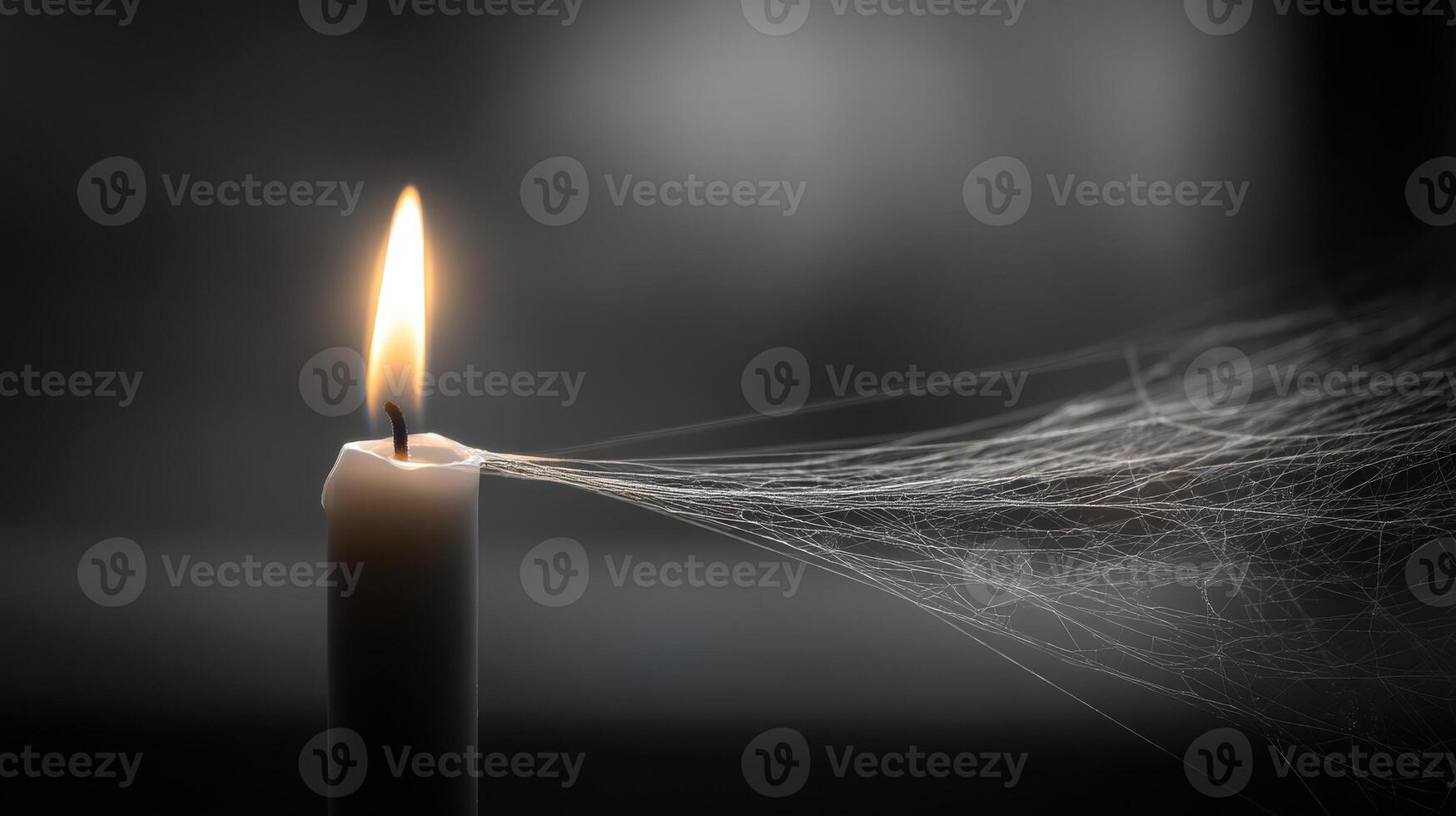 Gossamer Cobweb Spanning an Empty Corner with a Single Taper Candle Light photo