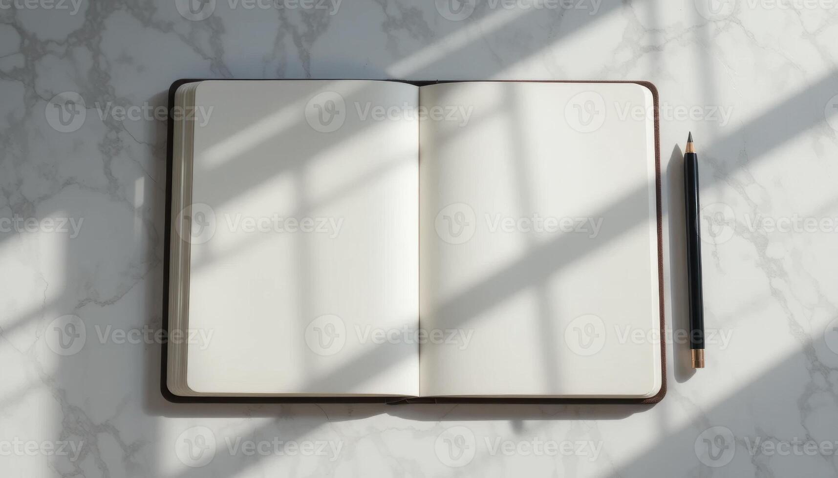 Open Notebook on a Marble Table With Shadows From Nearby Objects Casting Intricate Patterns photo