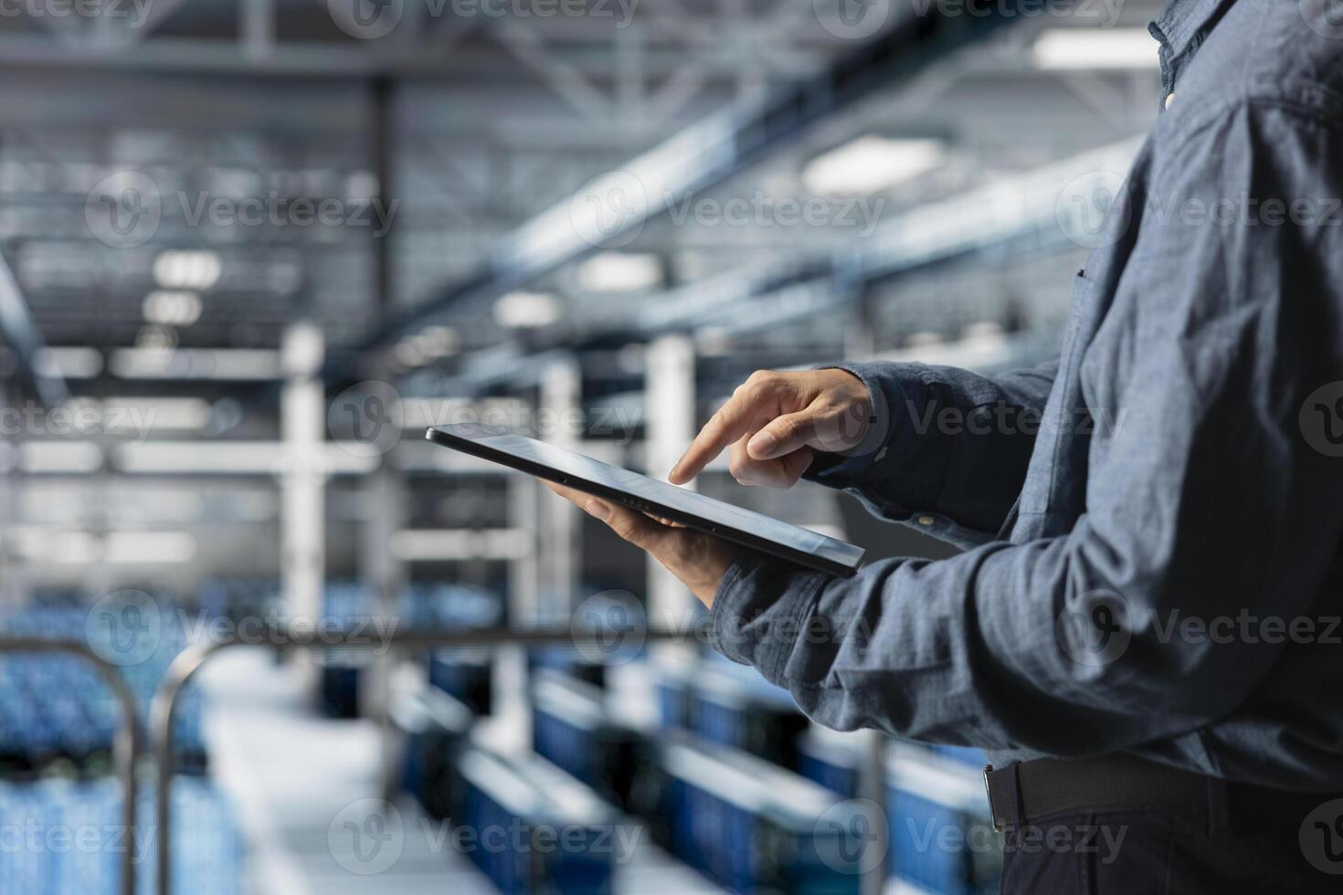 Close up of tablet used by data center technician to manage software updates for system stability. Server room IT expert optimizing performance with device, configuring infrastructure photo