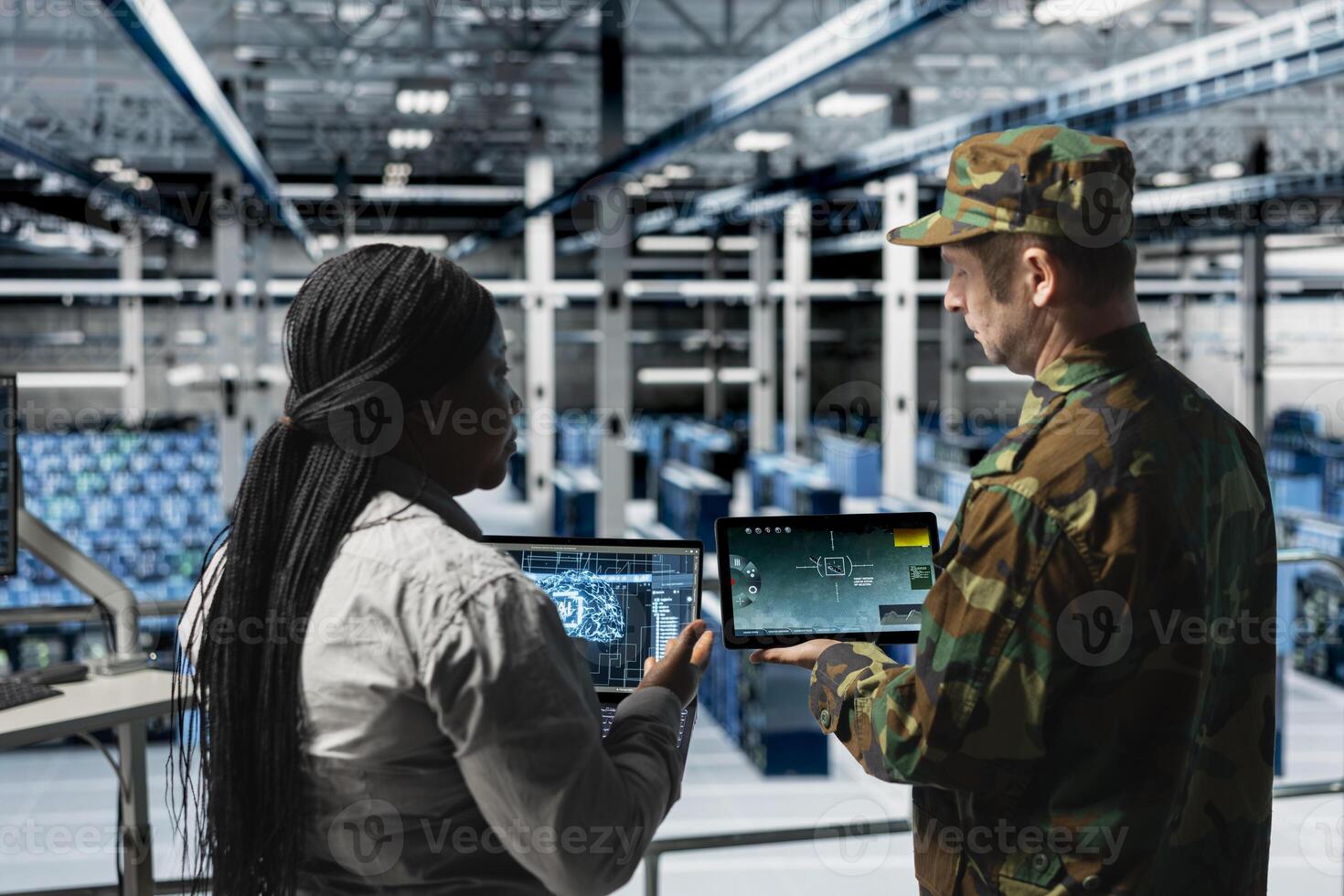 Army soldiers in data center training artificial intelligence to prioritize critical enemy targets. Military units in server room look at AI locking mechanism confirming hostile presence on screen photo