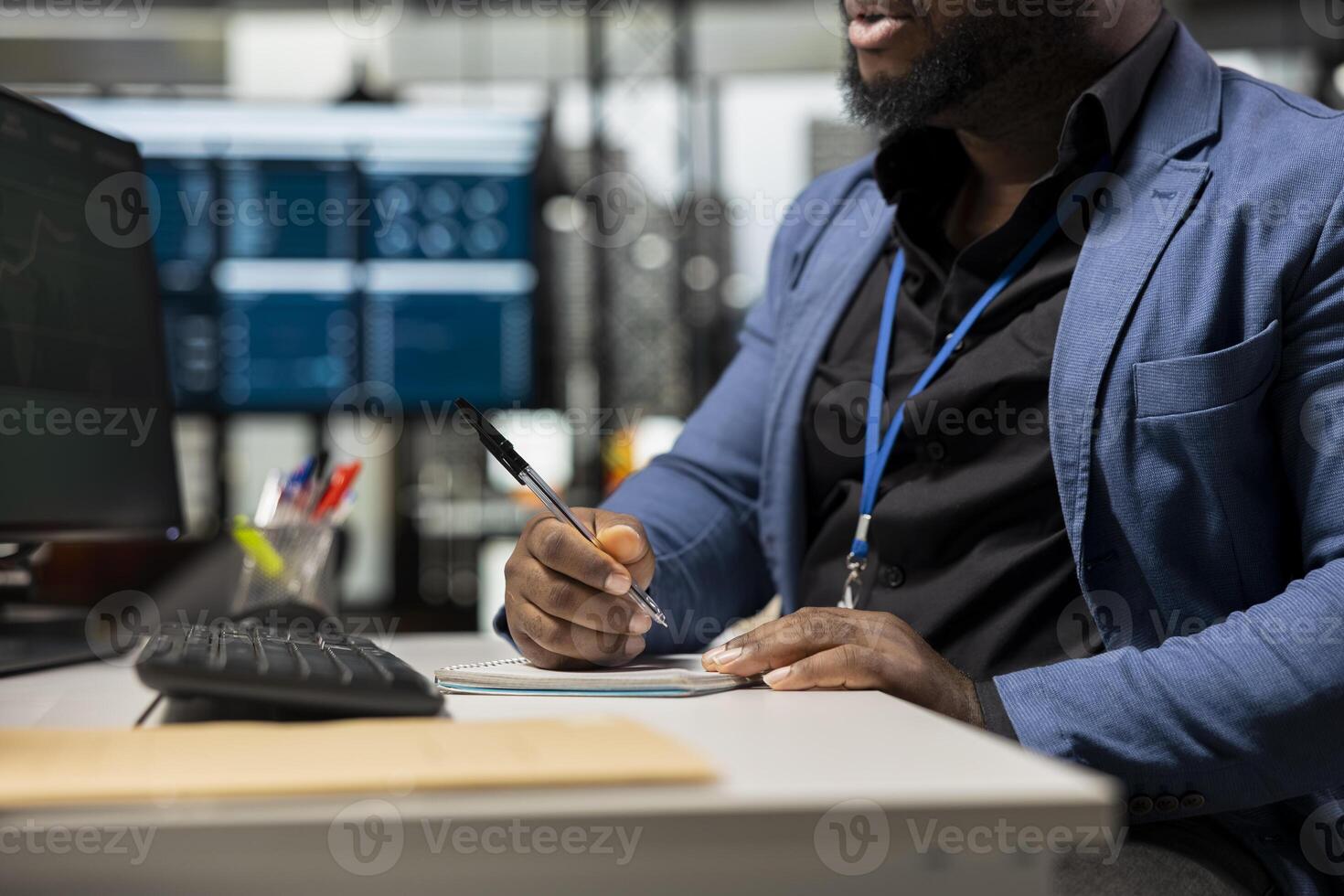 Black employee building new development strategy with notes, analyzing data and solutions to forecast project outcomes. Corporate professional working on briefing reports in the office. photo