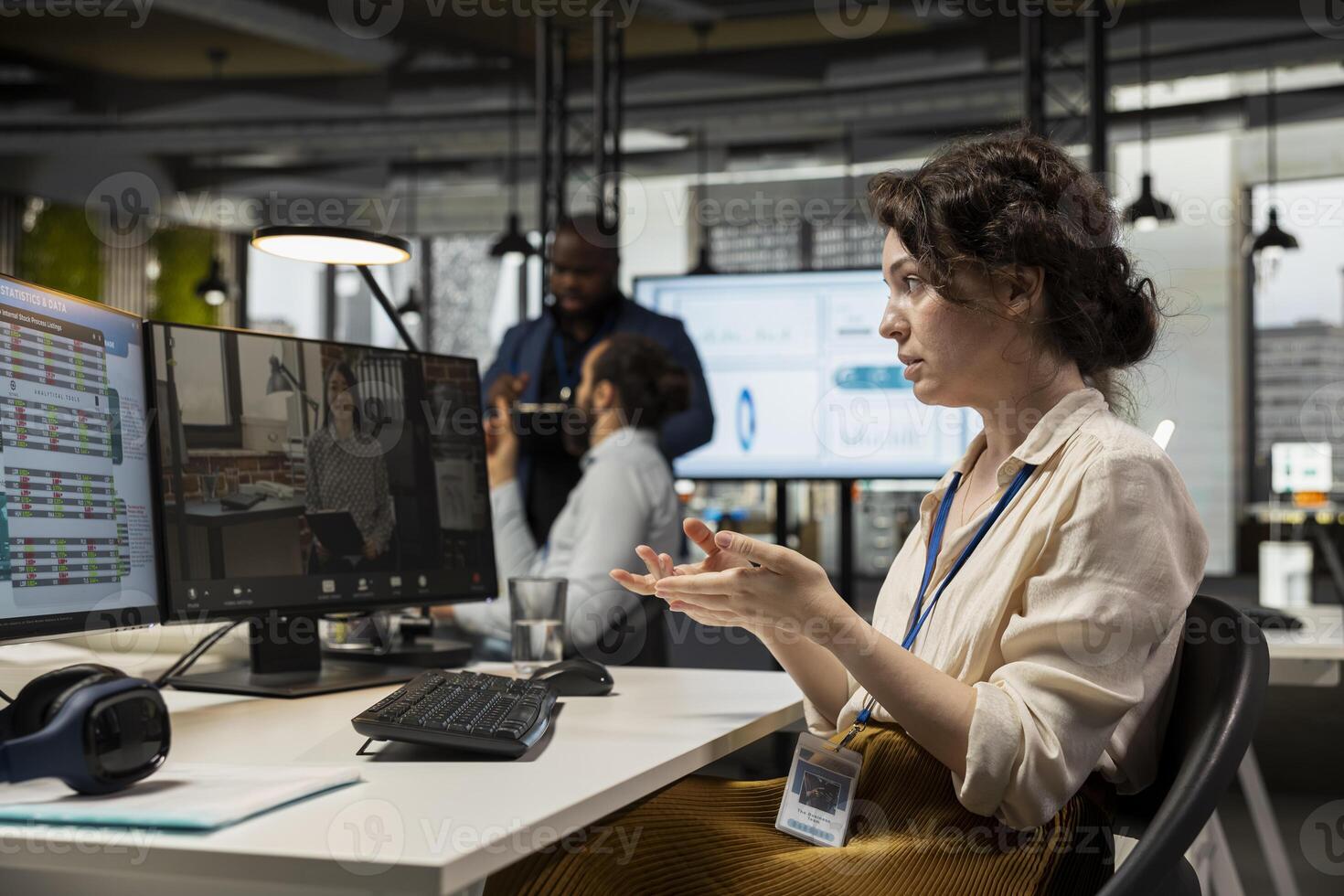 Employee engaging in discussion on call to share finance strategy details, using data analysis to create a briefing for reports. Building an effective partnership via conferencing. photo