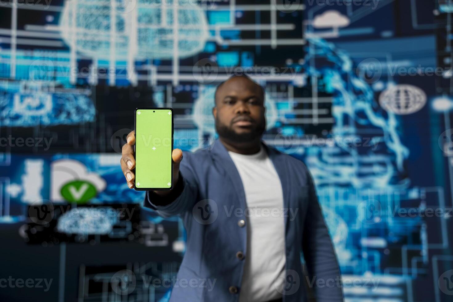 African american high tech strategist holding phone with isolated mockup display, analyzing predictive analytics and neural networks for virtual intelligence and platform innovation. photo