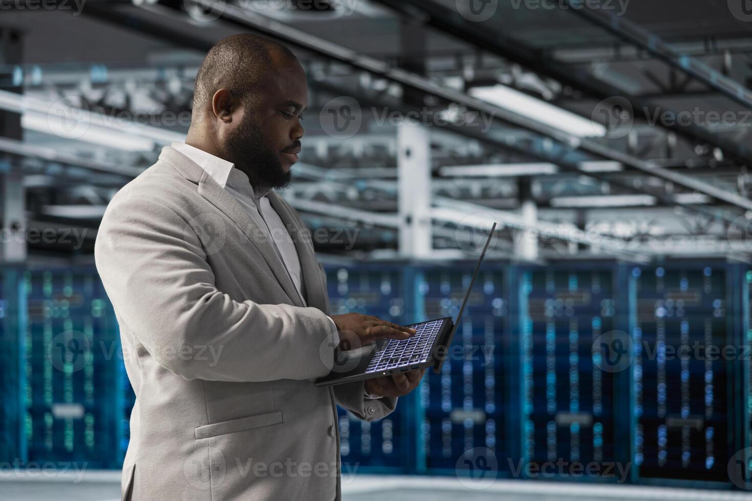 Data center employee running predictive maintenance scans, fixing network issues affecting rigs performance. Technician running system diagnostic tests, tracking resource utilization photo