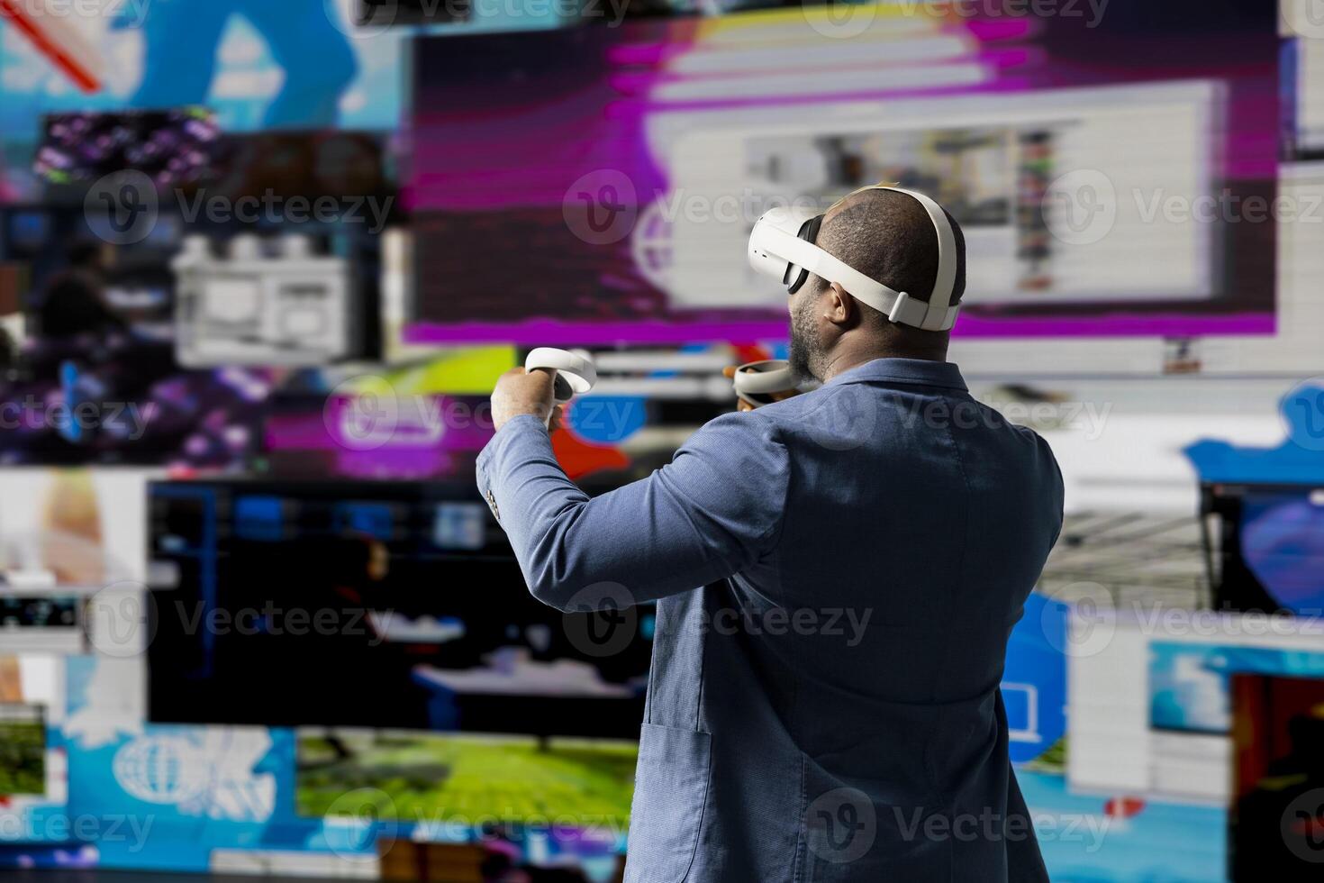 African american young person using virtual reality headset in mobile apps world, examining big data, visual content and emphasizing presence across tech platforms and social networks. photo