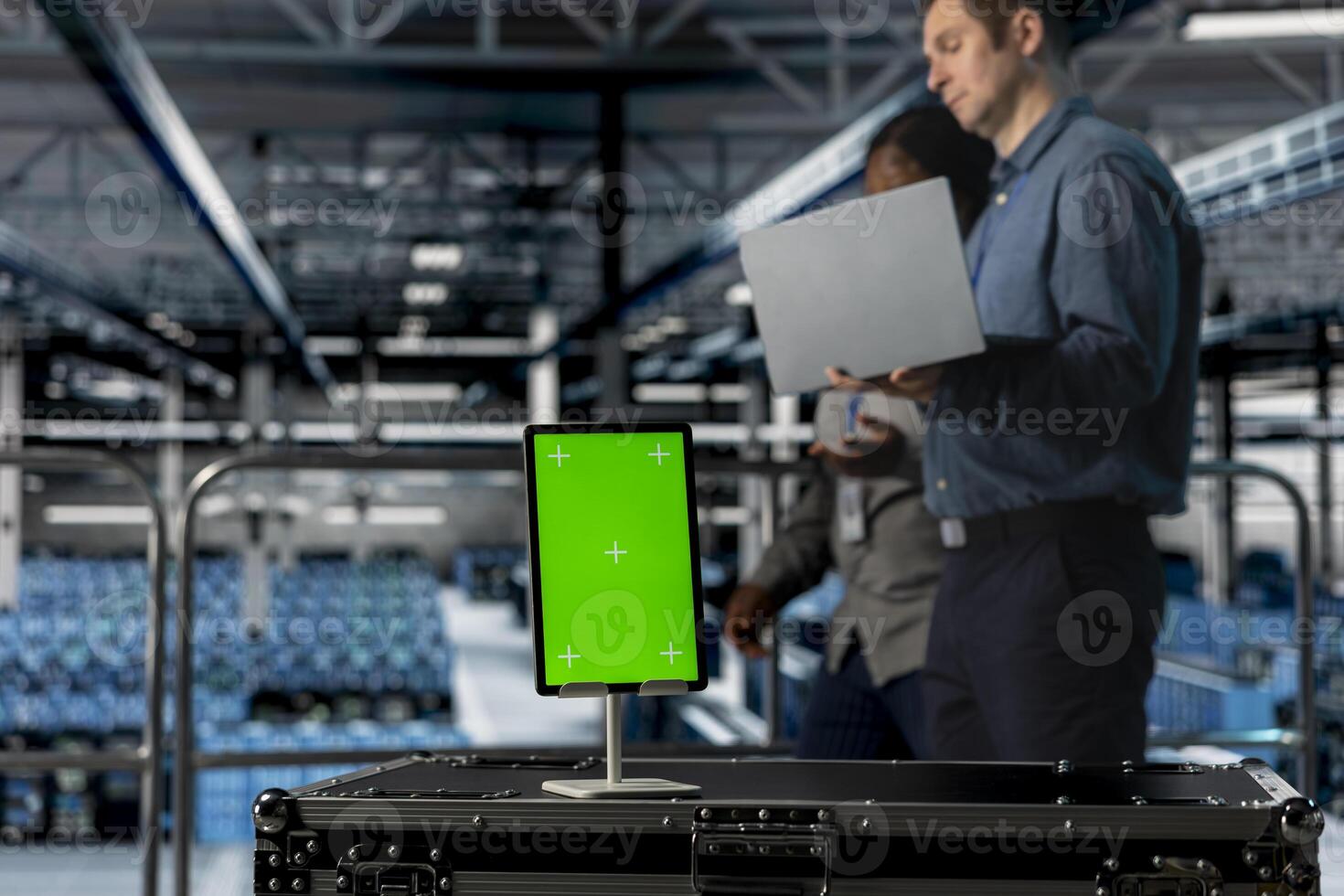 Close up of isolated screen tablet used by teamworking data center admins to reduce downtime. Server hub coworkers monitoring equipment performance using software on mockup device photo