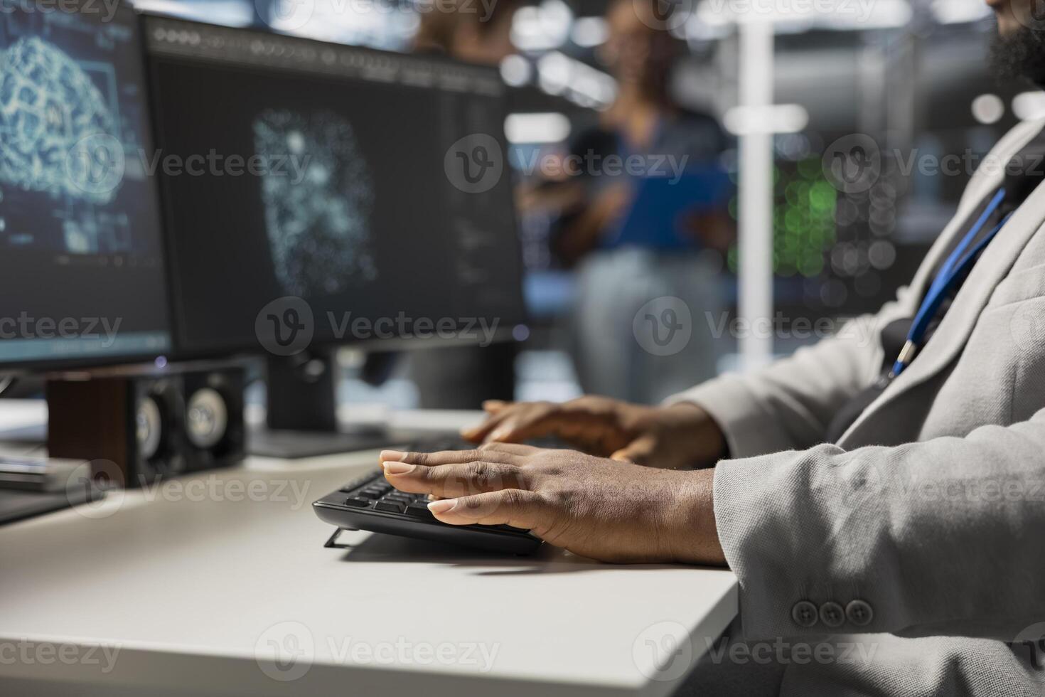 Close up of data center admin coding, using artificial intelligence networks tech. Server farm employee typing on PC keyboard, using AI programming language on computer to update equipment photo
