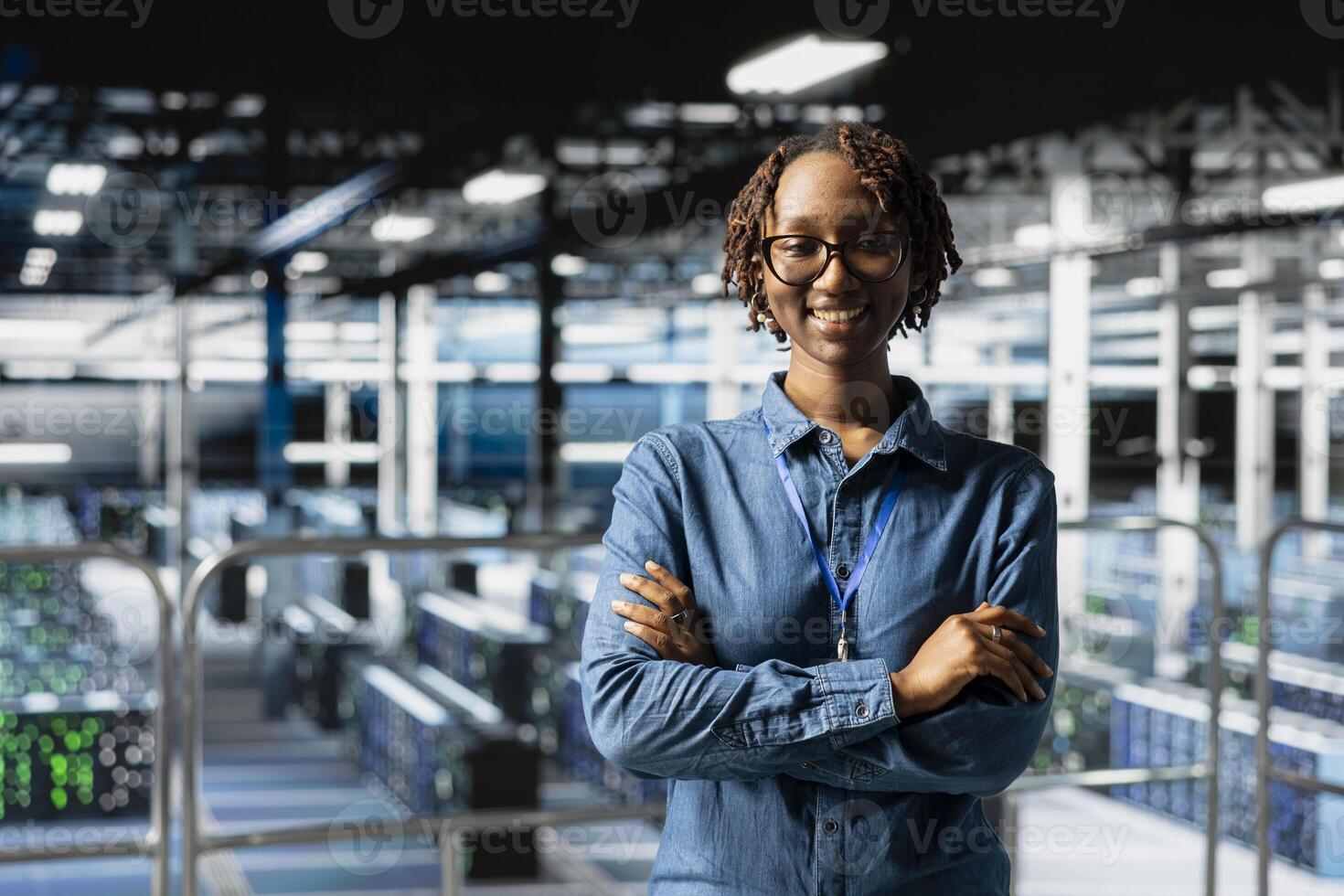 Portrait of smiling black expert works on data center industrial platform, completing software updates and ensuring deep learning automation. IT specialist troubleshooting configurations. photo
