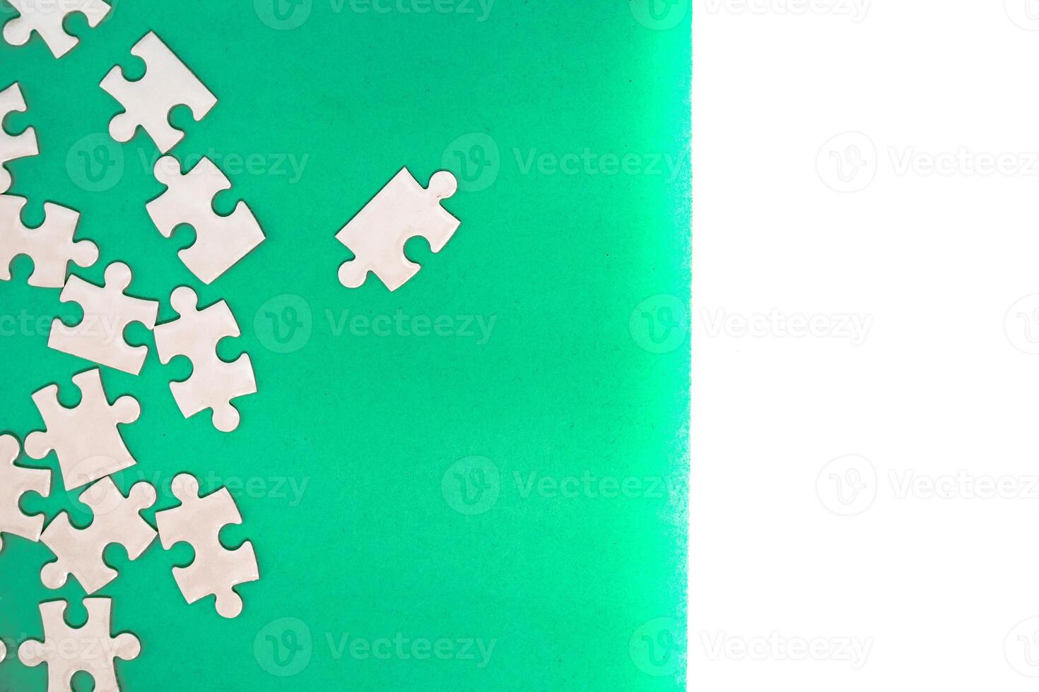 Unfinished White Puzzle on Green Background with a Blank Space, Concept of Problem Solving and Completing Tasks photo