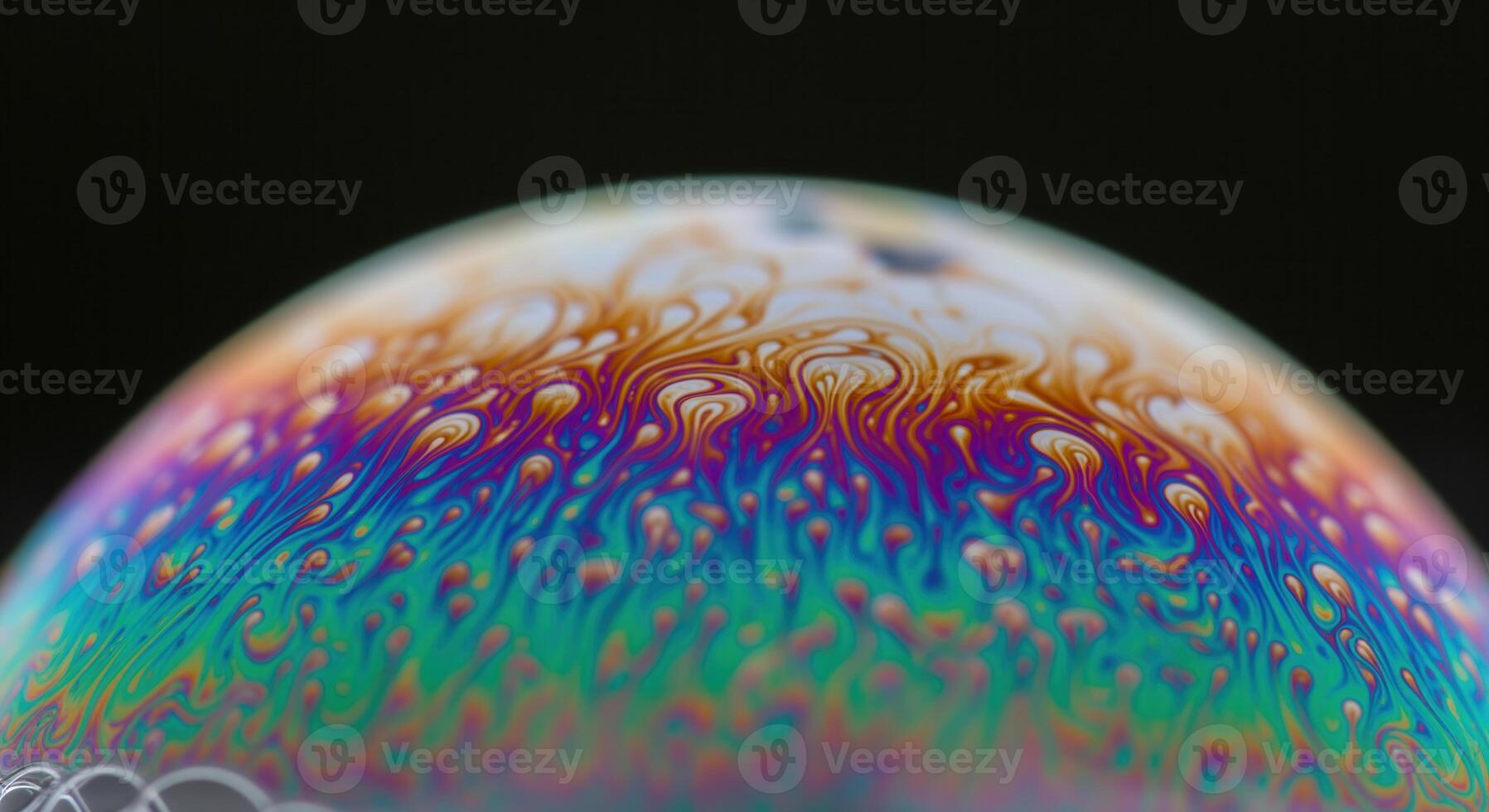 Macro shot of a vibrant iridescent soap bubble with swirling colorful patterns on its surface photo