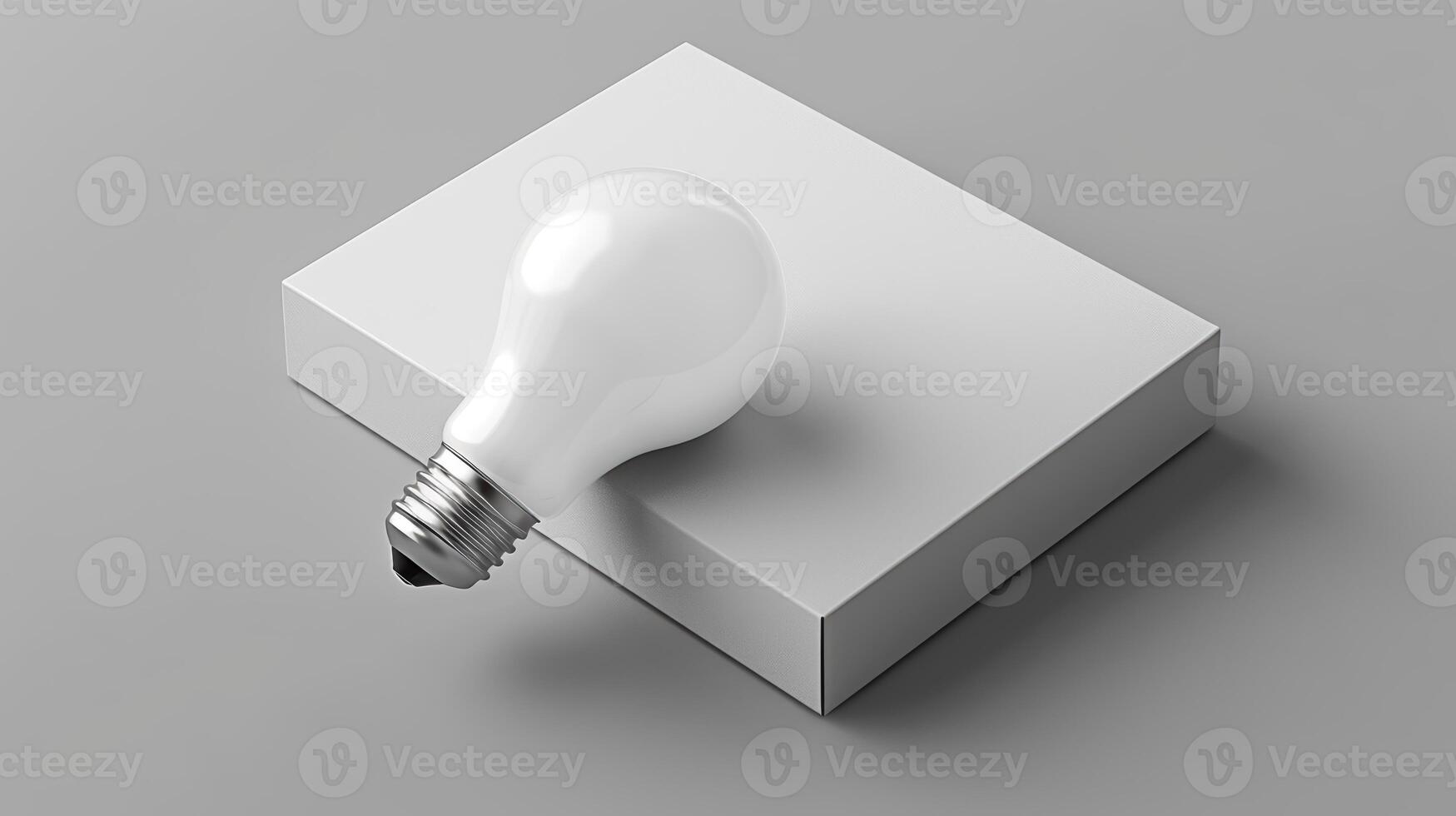 Light Bulb Resting on Simple Square White Base in Minimalist Style photo