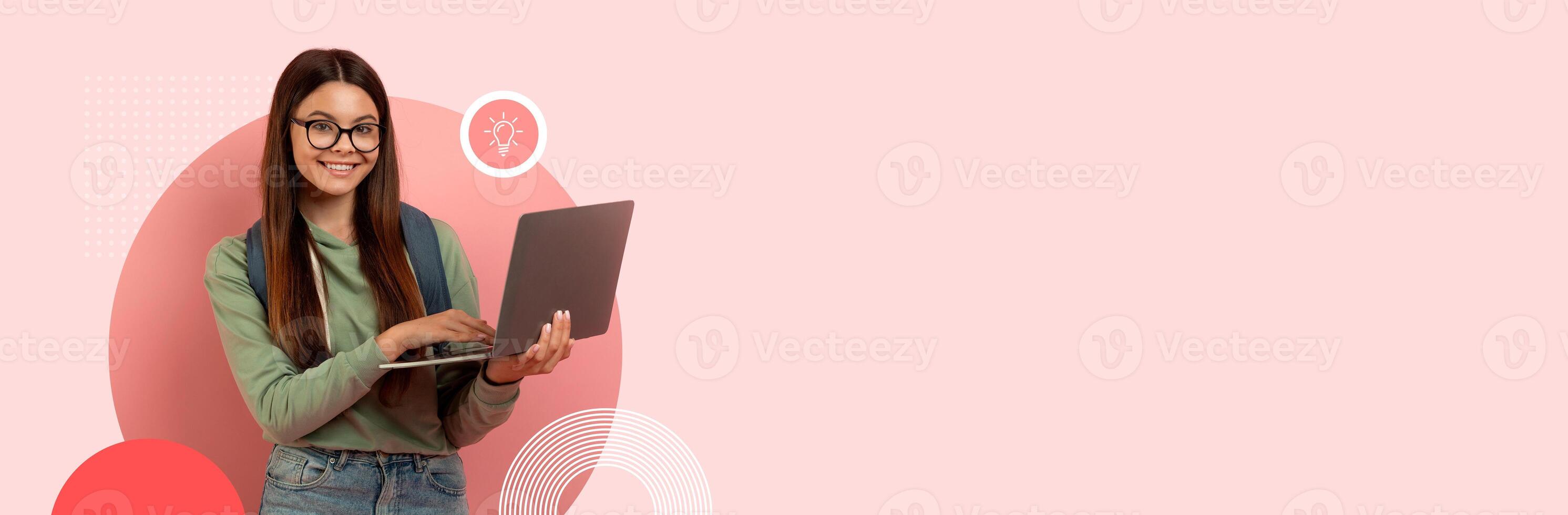 A student smiles while using a laptop for online learning in a modern educational environment. The background features vibrant colors, contributing to a lively atmosphere. photo