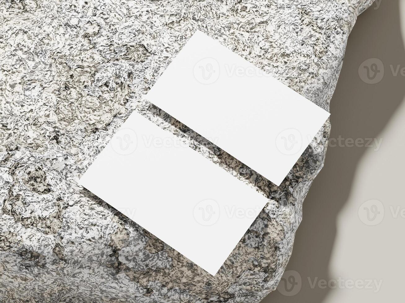 Modern business card resting on a textured stone surface with a simple, minimal design. photo