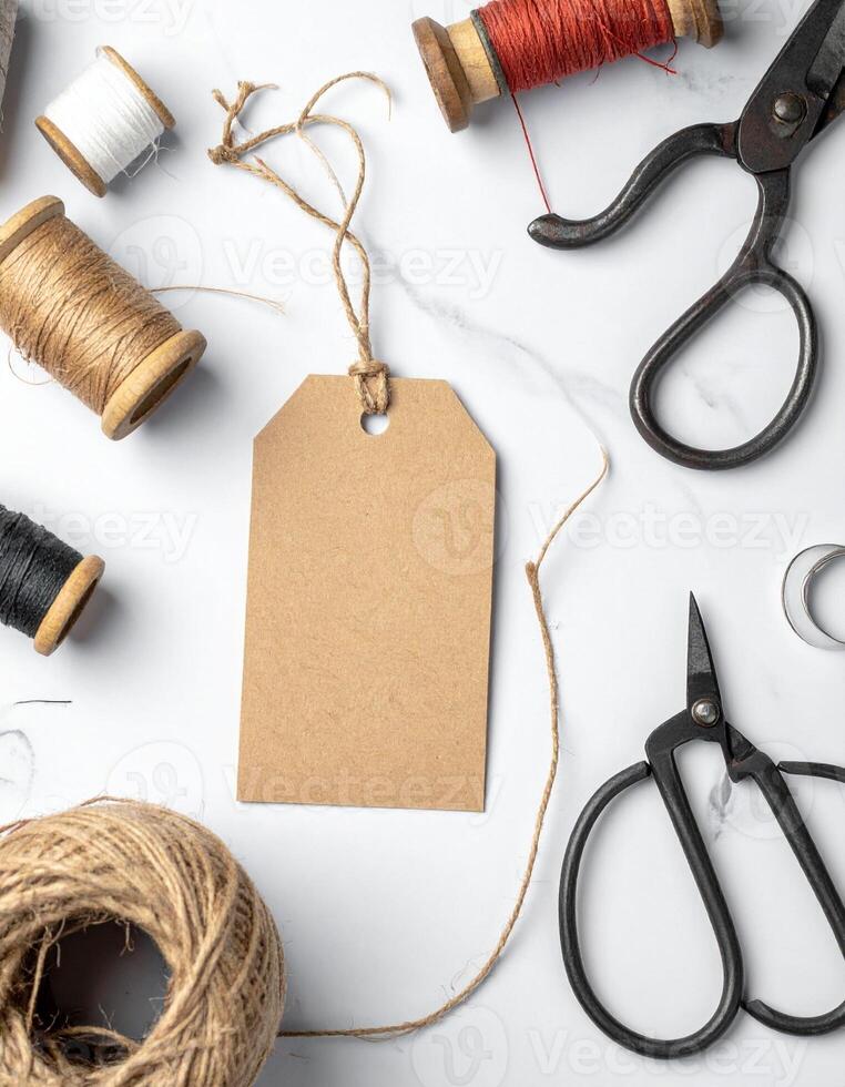 Crafting Essentials Threads Scissors and a Blank Tag for Creative Projects. photo