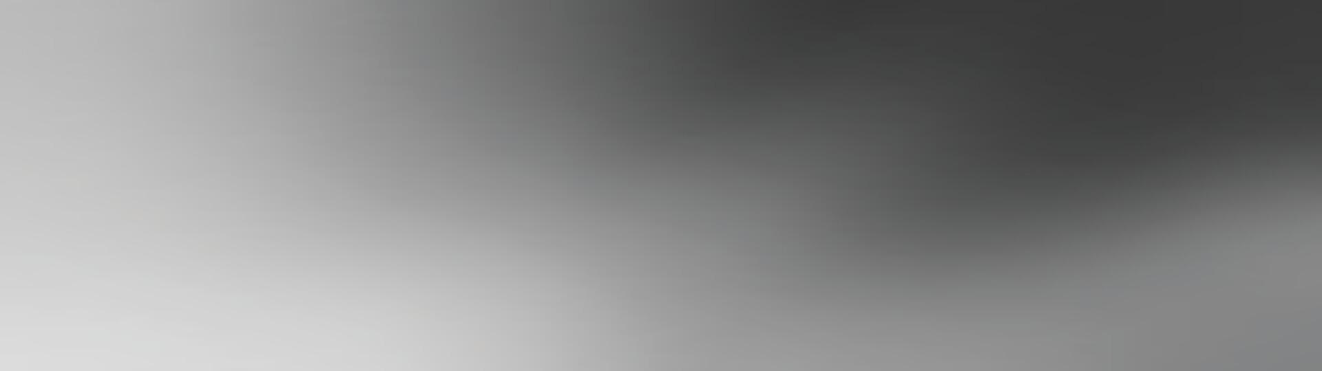 An abstract image featuring soft, blurred shapes and shades of gray, creating a sense of motion and depth.A blurred monochrome image showcasing a gradient of light and dark shades.abstract background vector