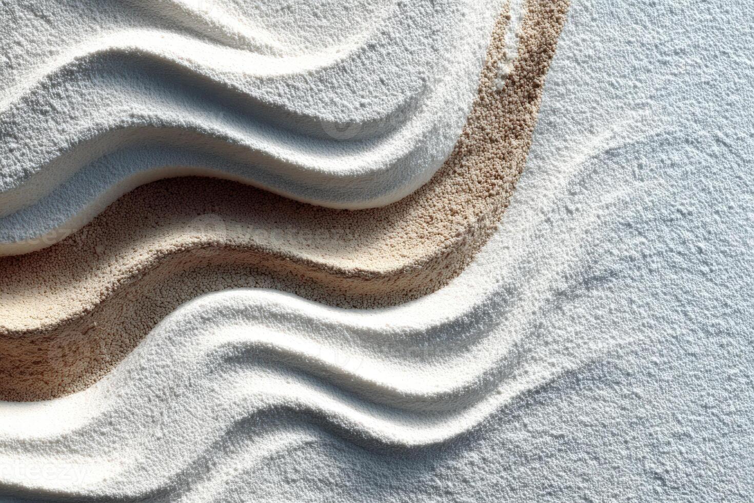 Abstract composition of white and brown sand creating flowing wave patterns on a textured surface, showcasing the beauty of natural materials and artistic design concepts photo
