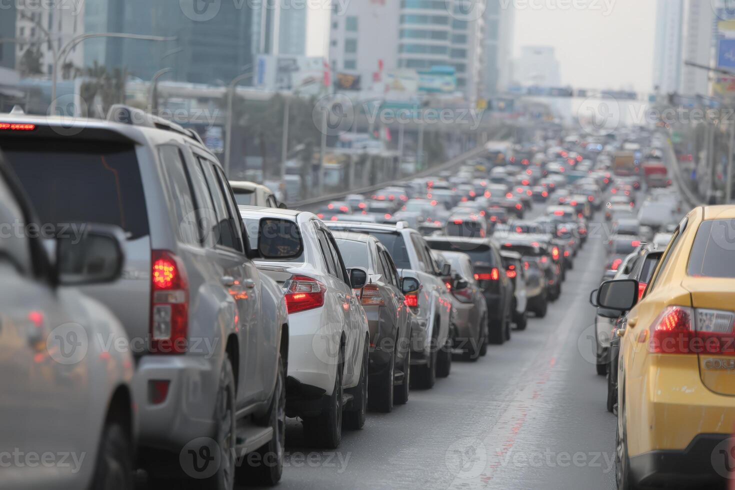 Traffic congestion on a busy urban road, with numerous vehicles lined up in a slow-moving queue, showcasing the challenges of city commuting and transportation dynamics photo