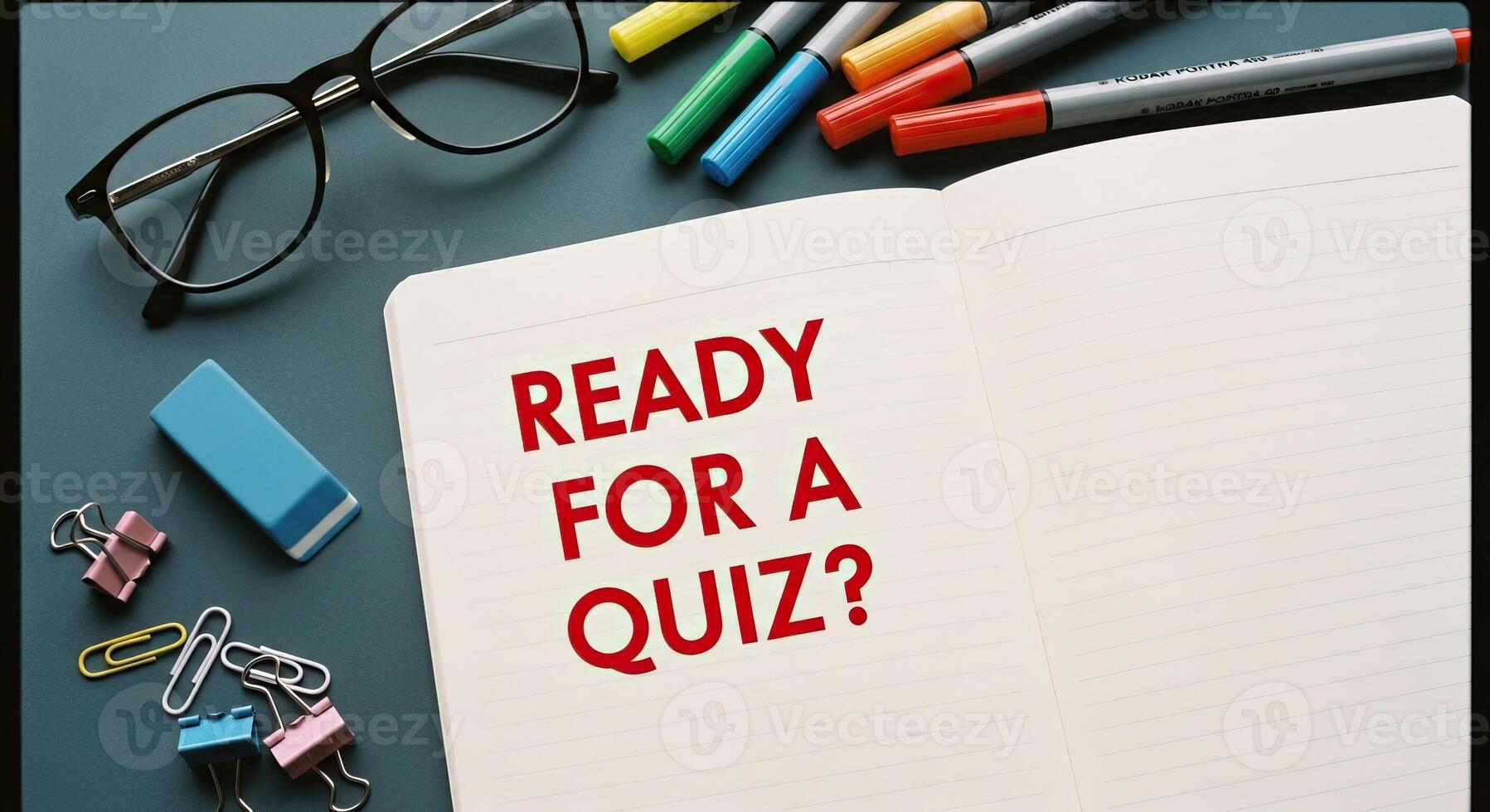 Quiz Time Overhead View of Open Notebook with Ready for a Quiz Text Surrounded by Stationery and Glasses photo