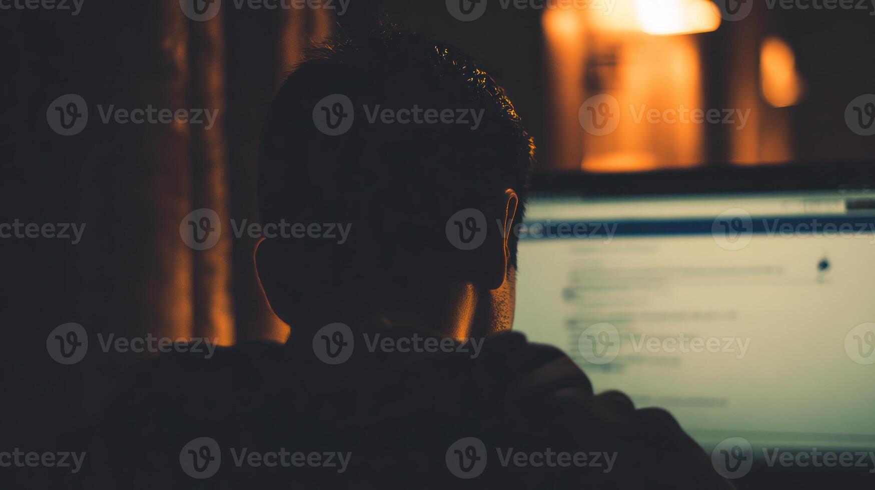 Person using computer in dimly lit room working technology concept photo