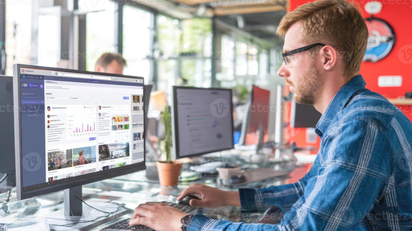 Man working on computer in office setting with modern technology elements photo