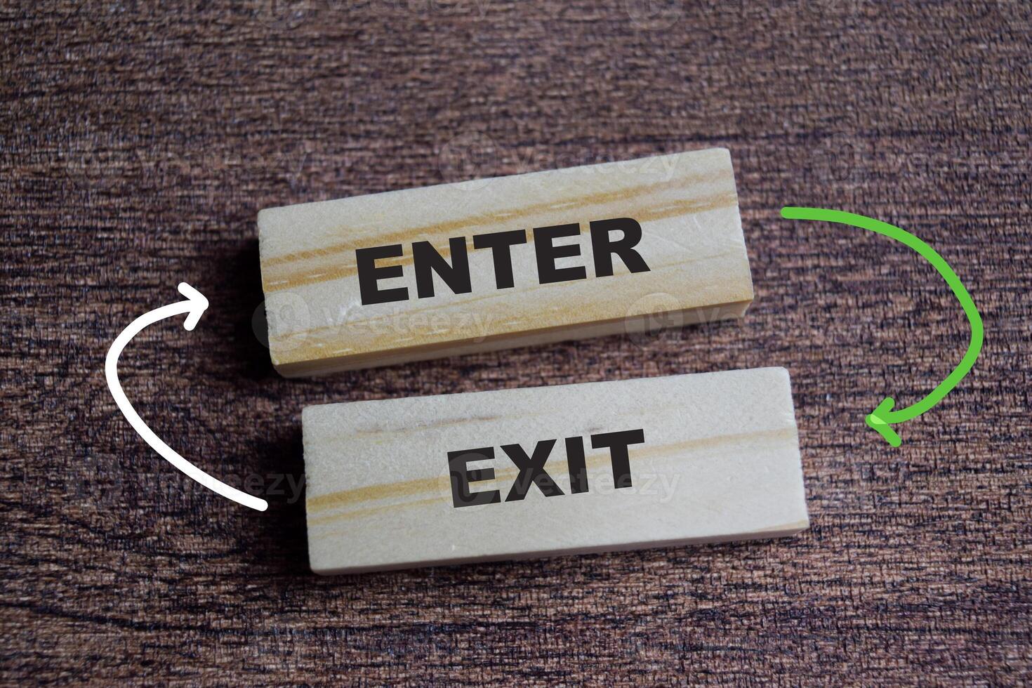 Enter and exit on stacked wooden cubes on the table. Symbolizing access and planning. Business and finance concept photo