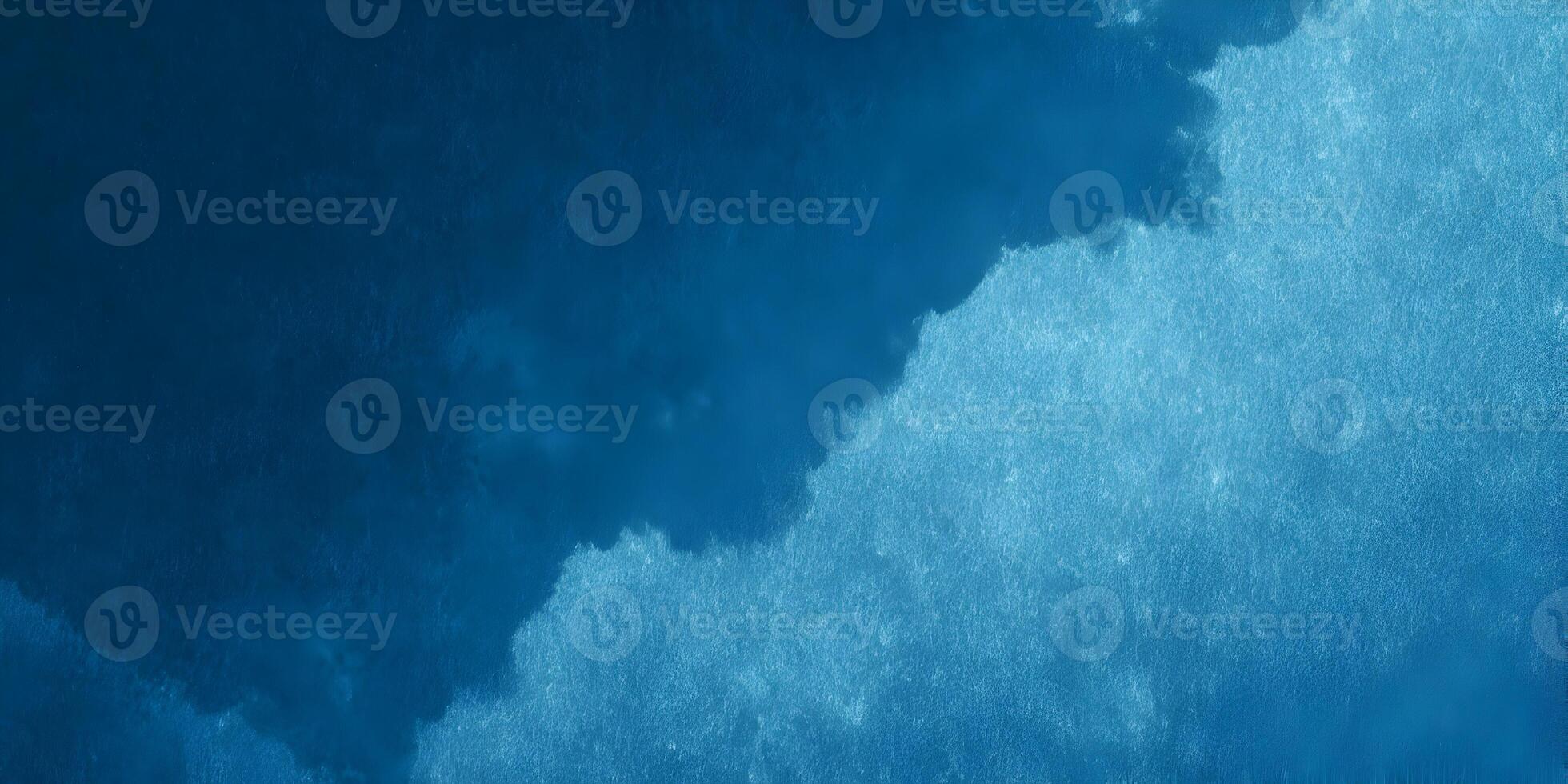 An abstract blue watercolor texture with a gradient from dark to light creates a calming background photo